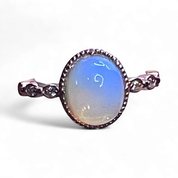 Beautiful gold color ring with bluish white opal looking stone. - Picture 2 of 8